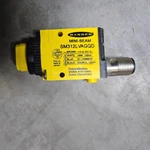 One New Banner Photoelectric Switch SM312CV2MHSQD. Fixed Price $105.00.